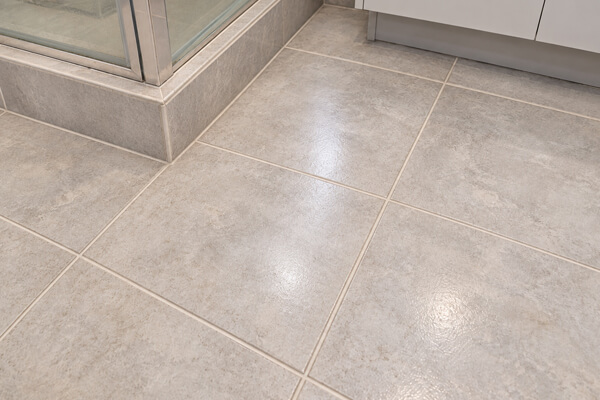 The same tiled floor and grout after professional cleaning