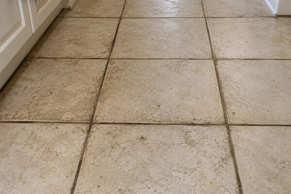 Natural stone floor before professional cleaning and restoration