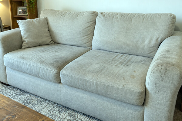 Fabric sofa before professional upholstery cleaning in Rugby